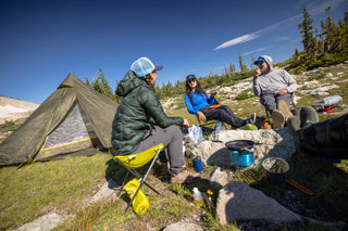 Sitting around the camp stove with friends