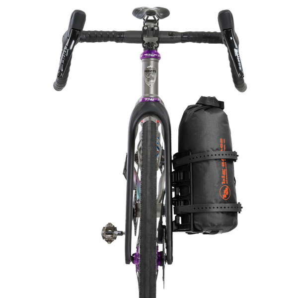 Bicycle with a black bag attached to the fork on a white background