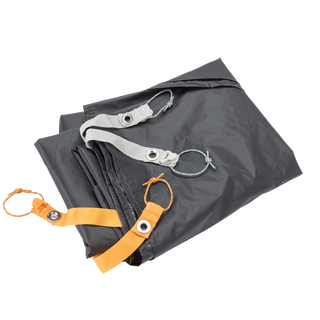 Folded gray Copper Spur UL1 Bikepack Footprint with orange and silver straps on a white background