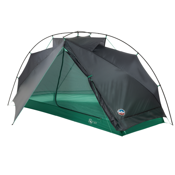 The Pitchpine VST 1.5 by Big Agnes Canada is a lightweight green and gray ultralight tent with its door open, showing the interior. Mesh panels offer ventilation, while flexible poles provide support; shown here on a plain white background.