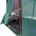 Camping tent with a sleeping bag inside, showing the interior setup.